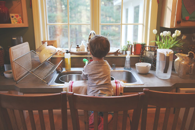 water, cups, bowls, + one happy kid.